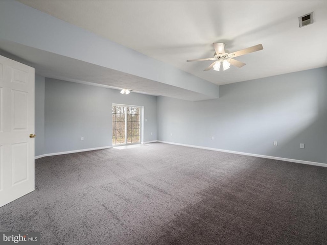 carpeted empty room featuring a ceiling fan, baseboards, and visible vents