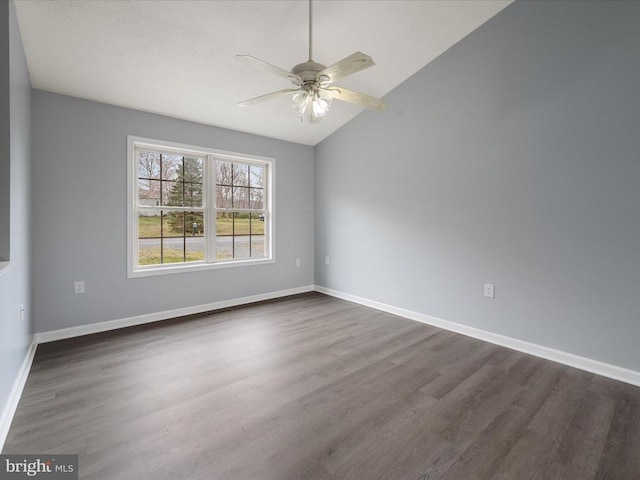 unfurnished room with a ceiling fan, lofted ceiling, and dark wood-type flooring