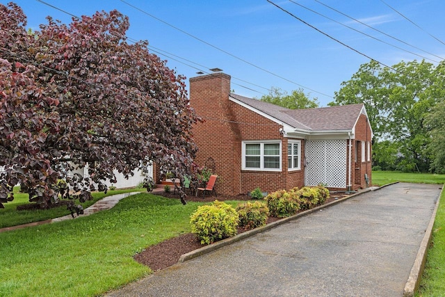 1435 Bluestone St, Harrisonburg, VA 22801 - view of side of home with brick siding, a chimney, a lawn, and roof with shingles