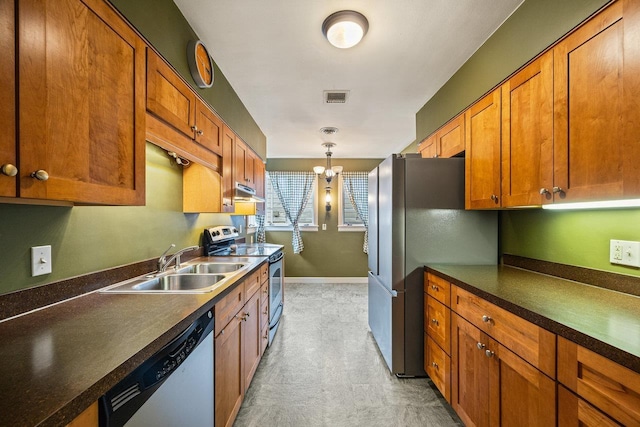 1435 Bluestone St, Harrisonburg, VA 22801 - kitchen with appliances with stainless steel finishes, a sink, under cabinet range hood, brown cabinets, and decorative light fixtures