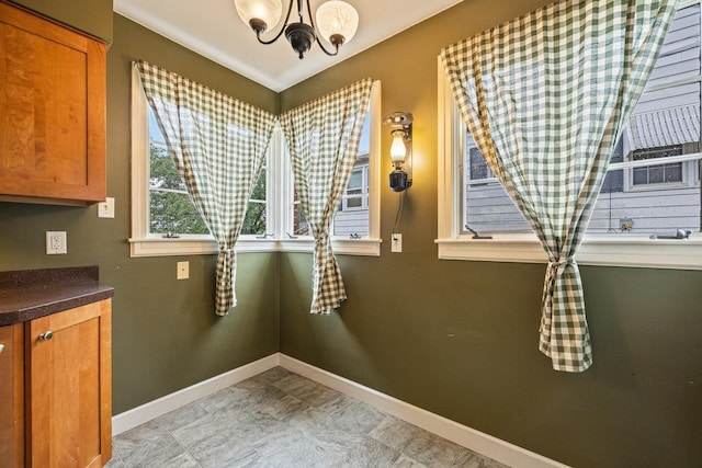 1435 Bluestone St, Harrisonburg, VA 22801 - unfurnished dining area featuring a chandelier and baseboards