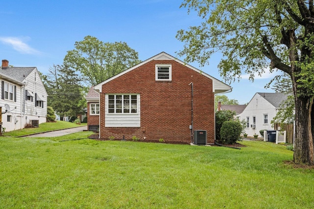 1435 Bluestone St, Harrisonburg, VA 22801 - rear view of property with brick siding, a yard, and central air condition unit