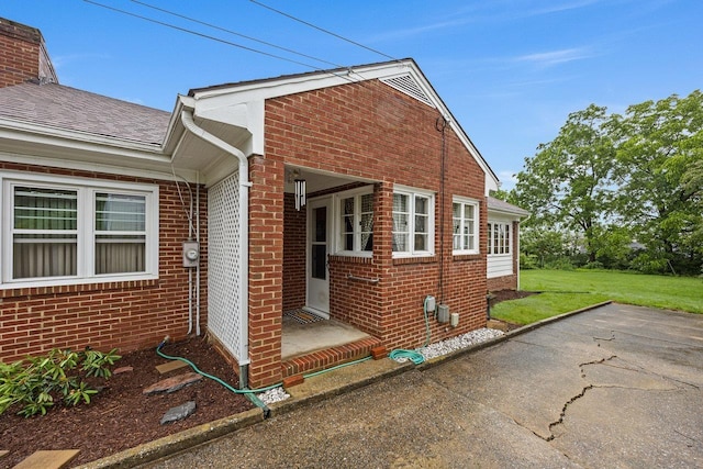 1435 Bluestone St, Harrisonburg, VA 22801 - view of property exterior featuring brick siding and a lawn