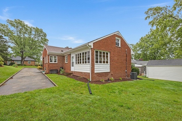 1435 Bluestone St, Harrisonburg, VA 22801 - back of property featuring brick siding, cooling unit, and a lawn