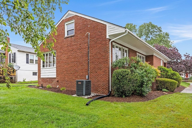 1435 Bluestone St, Harrisonburg, VA 22801 - view of home's exterior with brick siding, a lawn, and cooling unit