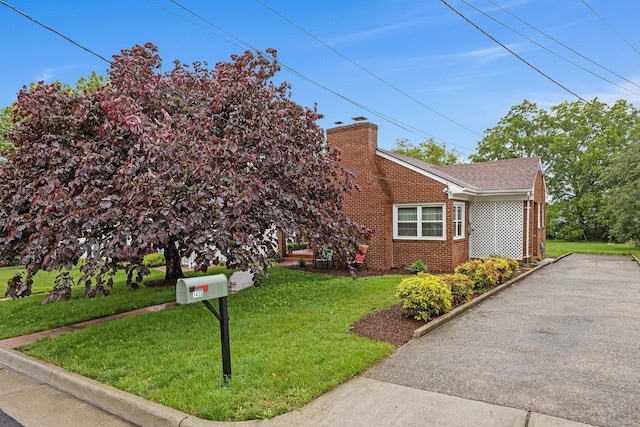 1435 Bluestone St, Harrisonburg, VA 22801 - view of front of house featuring brick siding, a front yard, and a chimney