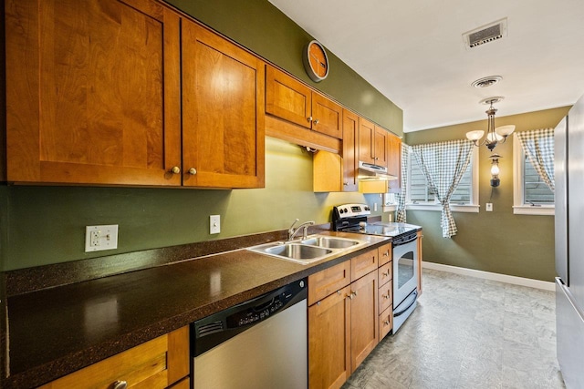 1435 Bluestone St, Harrisonburg, VA 22801 - kitchen featuring stainless steel appliances, under cabinet range hood, a sink, brown cabinets, and dark countertops