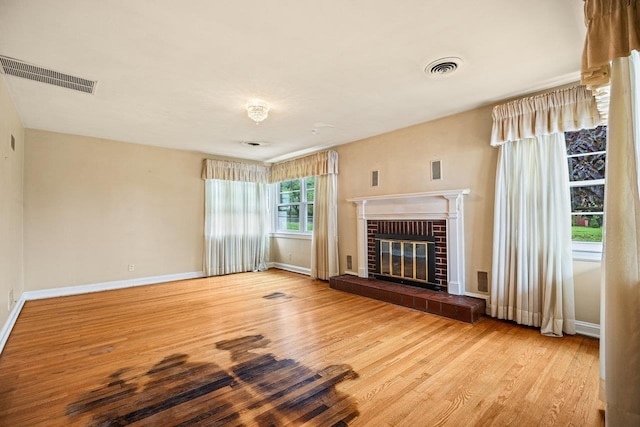 1435 Bluestone St, Harrisonburg, VA 22801 - unfurnished living room featuring wood finished floors, baseboards, and a fireplace
