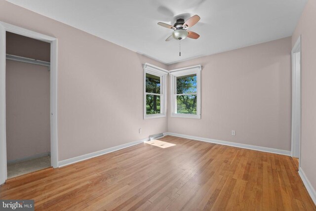12400 Constitution Hwy, Orange, VA 22960 - unfurnished bedroom with light wood-style flooring, baseboards, a closet, and ceiling fan