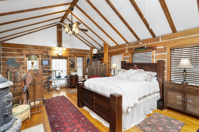 2665 Deerfield Valley Rd, Deerfield, VA 24432 - bedroom with beamed ceiling, wooden walls, wood-type flooring, and high vaulted ceiling