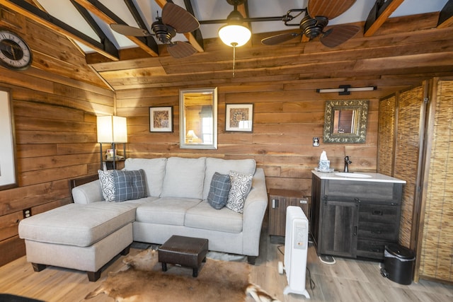 2665 Deerfield Valley Rd, Deerfield, VA 24432 - living room with light wood-type flooring, wood walls, a ceiling fan, and vaulted ceiling with beams
