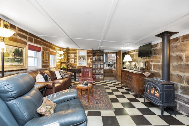 2665 Deerfield Valley Rd, Deerfield, VA 24432 - living area with a wood stove, wood walls, and tile patterned floors