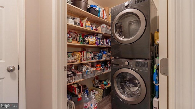 laundry area featuring laundry area and stacked washer and dryer