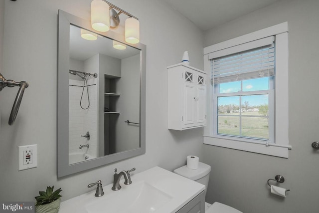 bathroom with toilet and vanity
