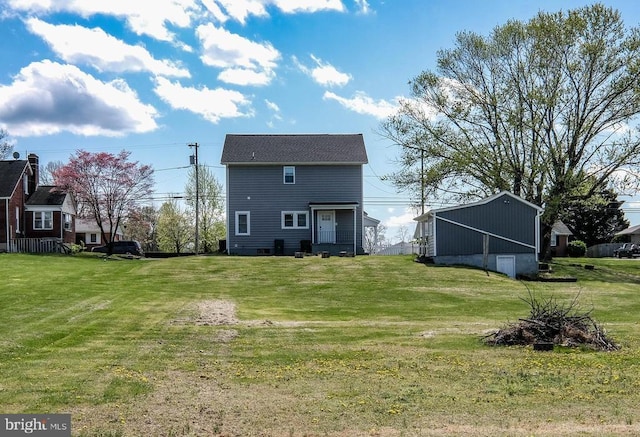 rear view of house with a lawn