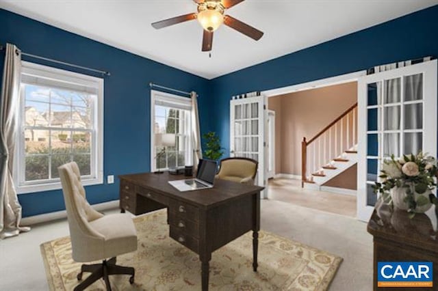 office featuring a ceiling fan, baseboards, carpet flooring, and french doors