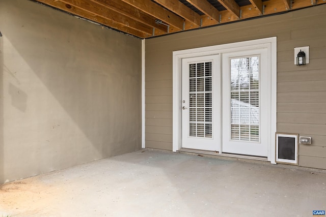 view of exterior entry featuring a patio