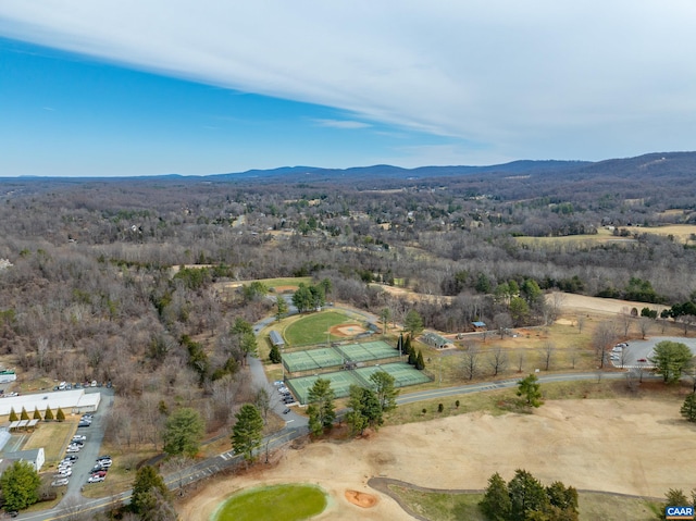 bird's eye view featuring a forest view and a mountain view
