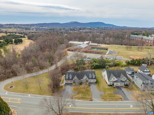birds eye view of property with a mountain view