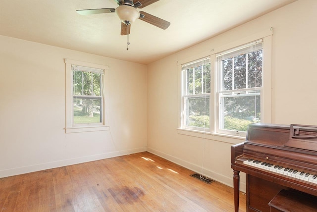 530 Water St W, Harrisonburg, VA 22801 - living area with light wood-type flooring, healthy amount of natural light, baseboards, and ceiling fan