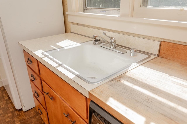 530 Water St W, Harrisonburg, VA 22801 - detailed view of a sink, light countertops, and brown cabinetry