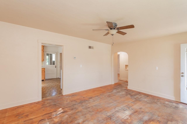 530 Water St W, Harrisonburg, VA 22801 - unfurnished room with arched walkways, a ceiling fan, light wood finished floors, and baseboards