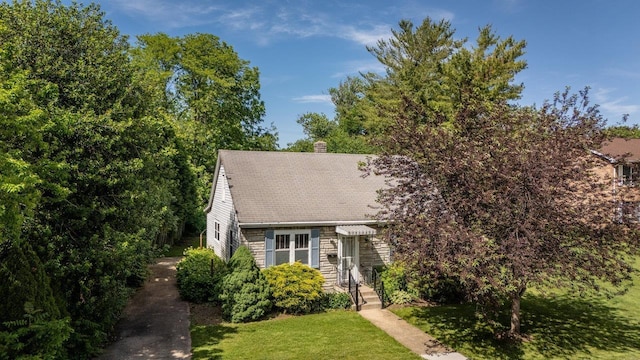 530 Water St W, Harrisonburg, VA 22801 - view of front of house featuring a front yard, a chimney, and a shingled roof