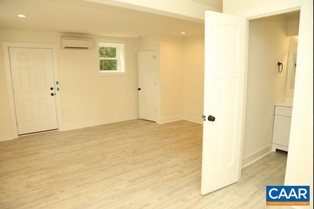 2228 Center Ave, Charlottesville, VA 22903 - empty room with recessed lighting, an AC wall unit, baseboards, and light wood-style floors