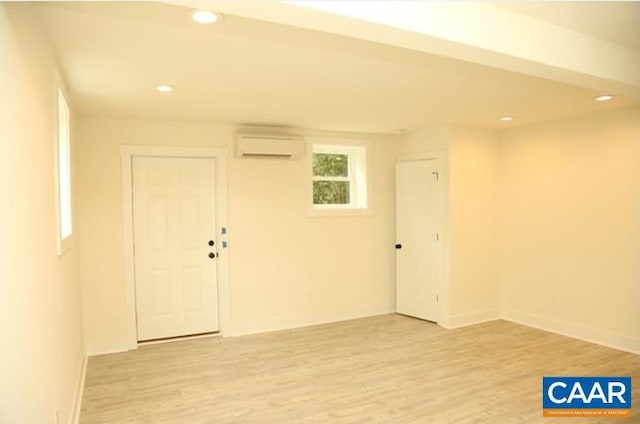 2228 Center Ave, Charlottesville, VA 22903 - empty room featuring baseboards, light wood-style flooring, recessed lighting, and a wall mounted AC