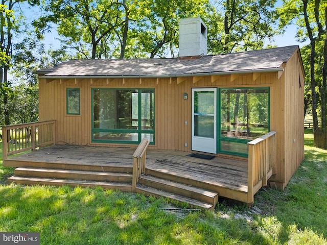 - deck featuring a lawn