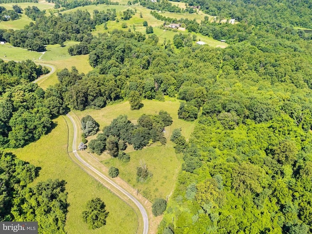  - drone / aerial view of a heavily wooded area