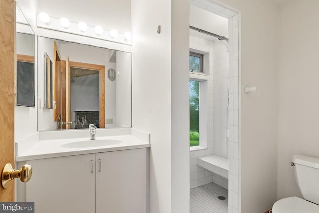  - full bath with a tile shower and vanity