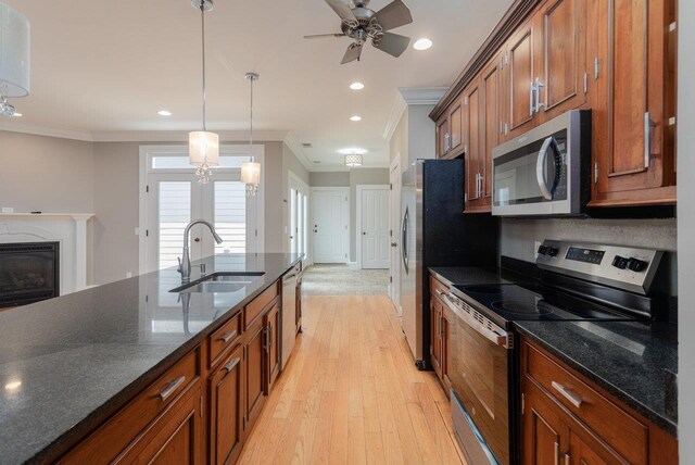 3277 Preston Shore Dr, Rockingham, VA 22801 - kitchen with stainless steel appliances, light wood-type flooring, brown cabinets, ornamental molding, and pendant lighting