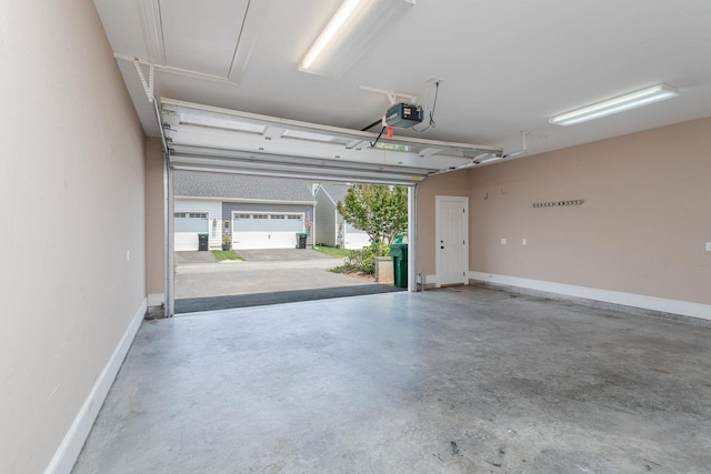3277 Preston Shore Dr, Rockingham, VA 22801 - garage featuring a garage door opener and baseboards
