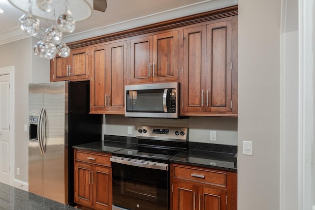 3277 Preston Shore Dr, Rockingham, VA 22801 - kitchen featuring stainless steel appliances, ornamental molding, brown cabinetry, and dark stone countertops