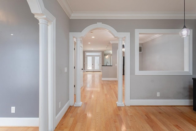 3277 Preston Shore Dr, Rockingham, VA 22801 - hallway with light wood-style flooring, ornamental molding, arched walkways, and decorative columns
