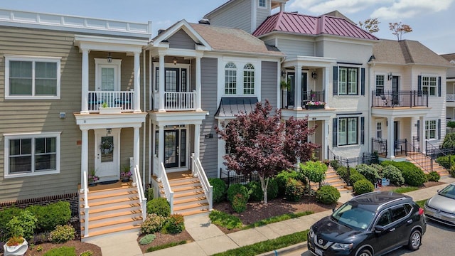 3277 Preston Shore Dr, Rockingham, VA 22801 - view of property featuring stairs, a balcony, a standing seam roof, and a metal roof