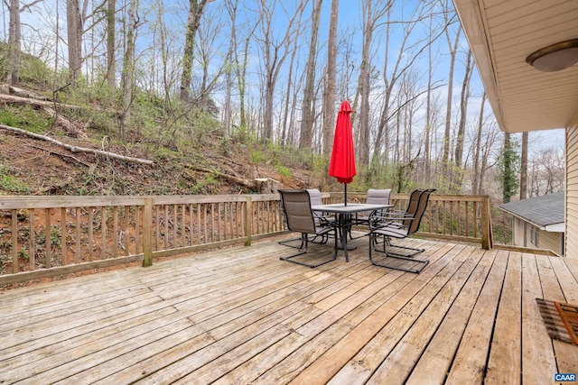 wooden deck with outdoor dining space
