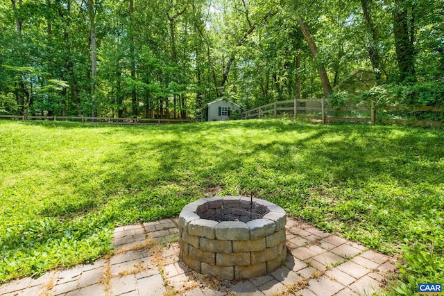 13 Landing Ct, Palmyra, VA 22963 - view of yard with a fire pit, a patio area, an outdoor structure, and a view of trees