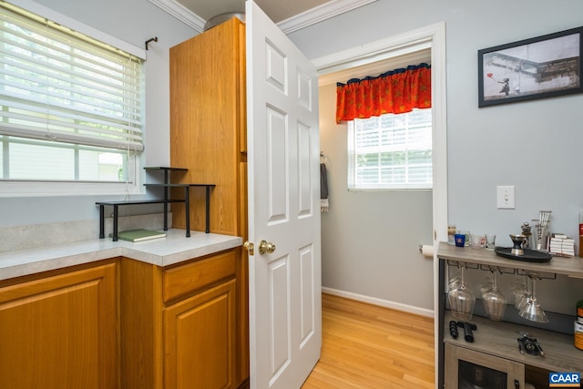 13 Landing Ct, Palmyra, VA 22963 - interior space with light wood finished floors, crown molding, light countertops, brown cabinets, and baseboards