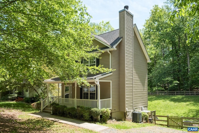 13 Landing Ct, Palmyra, VA 22963 - view of home's exterior with covered porch, central air condition unit, a chimney, and roof with shingles