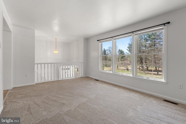 empty room with carpet floors and baseboards
