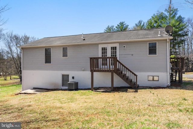 rear view of house featuring stairs, a yard, a wooden deck, french doors, and central AC unit