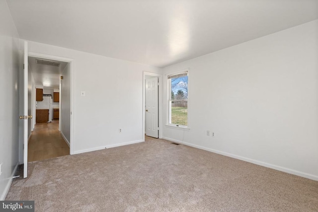 unfurnished bedroom with carpet floors and baseboards