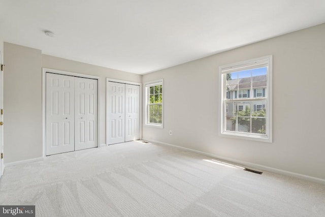 546 Highland Towne Ln, Warrenton, VA 20186 - unfurnished bedroom with two closets and carpet