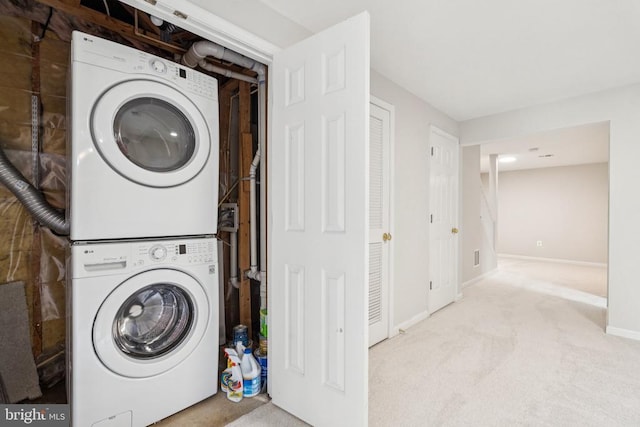 546 Highland Towne Ln, Warrenton, VA 20186 - laundry area featuring stacked washer / dryer and carpet flooring