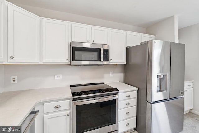 546 Highland Towne Ln, Warrenton, VA 20186 - kitchen with appliances with stainless steel finishes, white cabinets, and light countertops