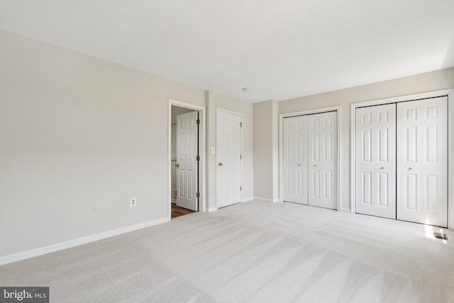 546 Highland Towne Ln, Warrenton, VA 20186 - unfurnished bedroom featuring carpet and two closets