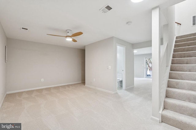 546 Highland Towne Ln, Warrenton, VA 20186 - spare room featuring a ceiling fan, stairway, and light carpet