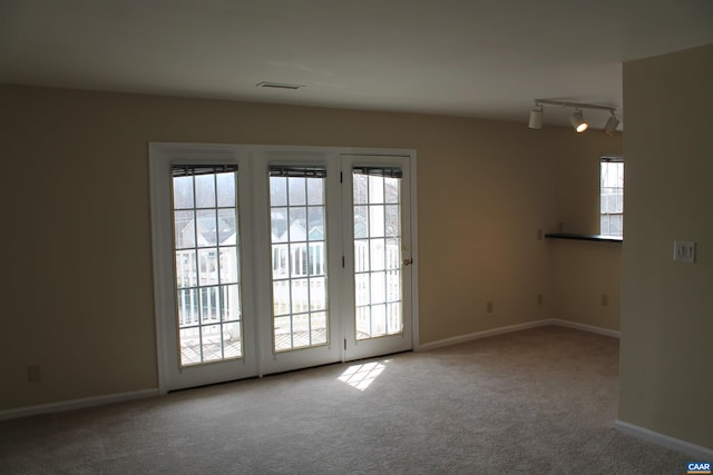 1313 Villa Way Unit F, Charlottesville, VA 22903 - empty room with carpet flooring, baseboards, track lighting, and visible vents